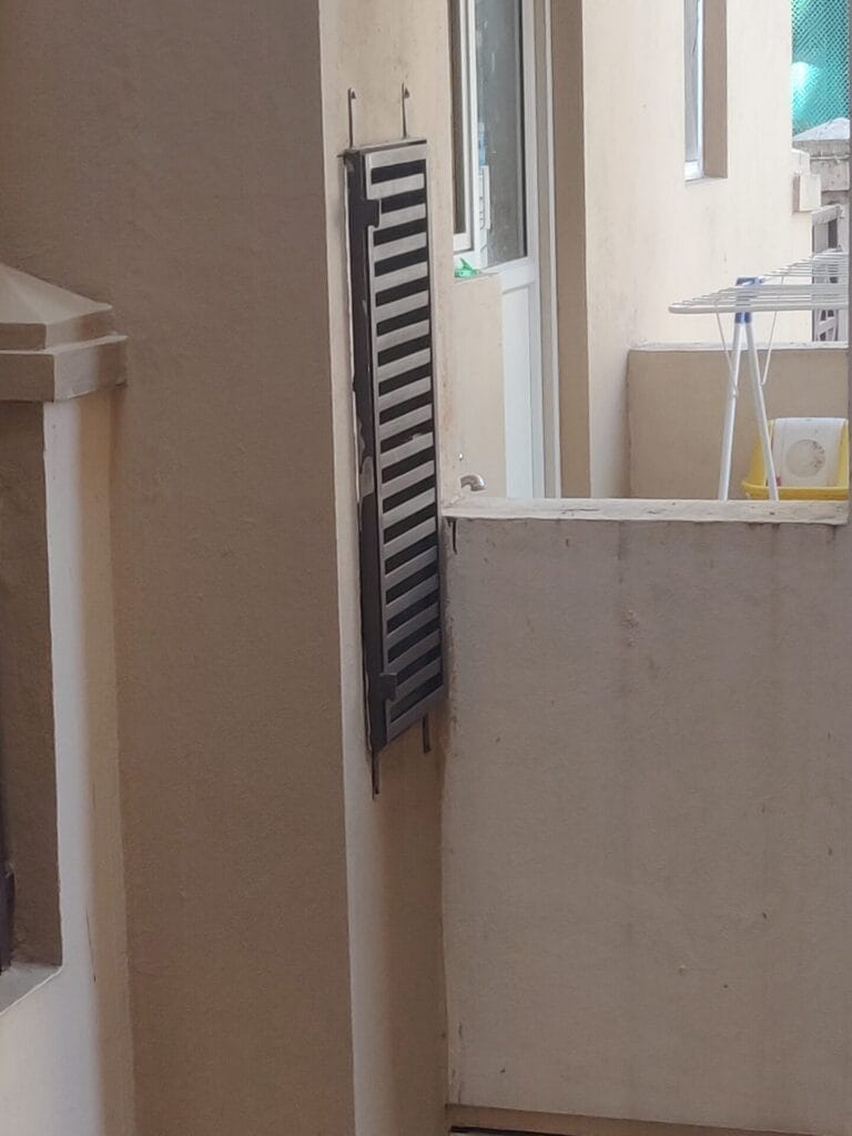 a closed duct embedded in the wall