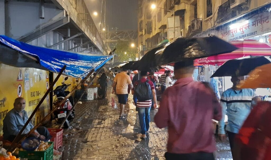 people walking in rains in Mumbai 