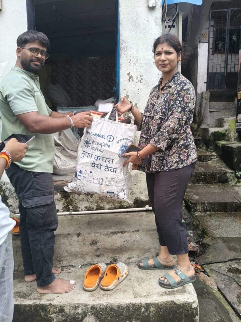 A resident of Bhim Ngar handing over dry waste
