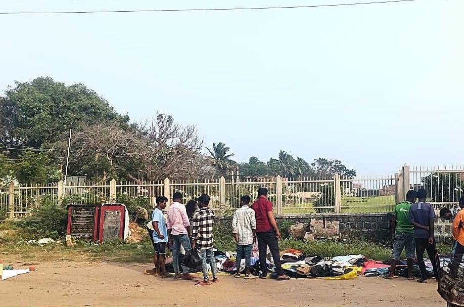 MAPS workers shopping for clothes at a roadside thrift shop.